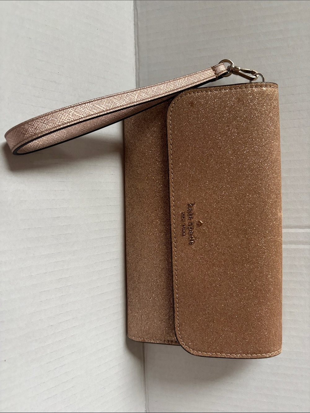 kate spade glitter wristlet in rose gold-tone